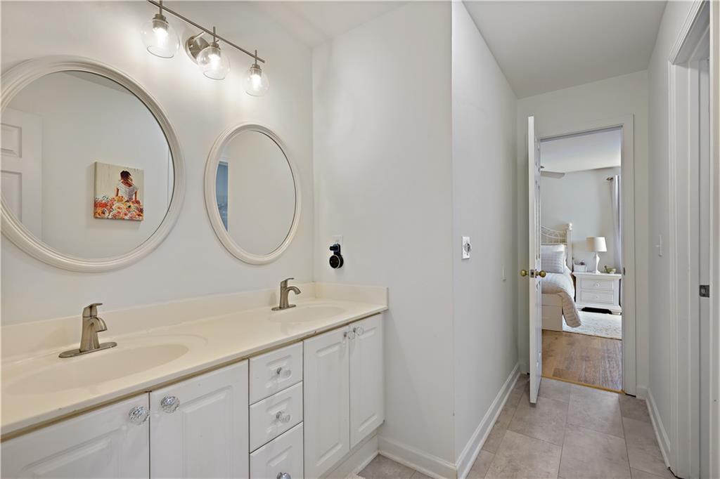 3038 Fairhaven Ridge Northwest Kennesaw, GA 30144 - Photo 24 of 55 a bathroom with a double vanity sink and a mirror