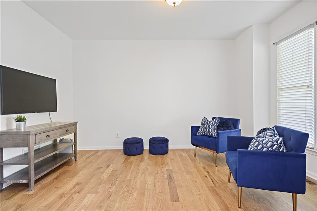 3038 Fairhaven Ridge Northwest Kennesaw, GA 30144 - Photo 29 of 55 a living room with furniture and a flat screen tv