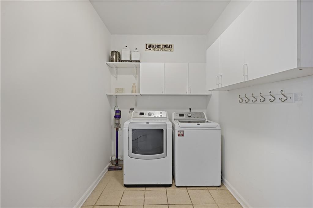 3038 Fairhaven Ridge Northwest Kennesaw, GA 30144 - Photo 30 of 55 a utility room with dryer and washer