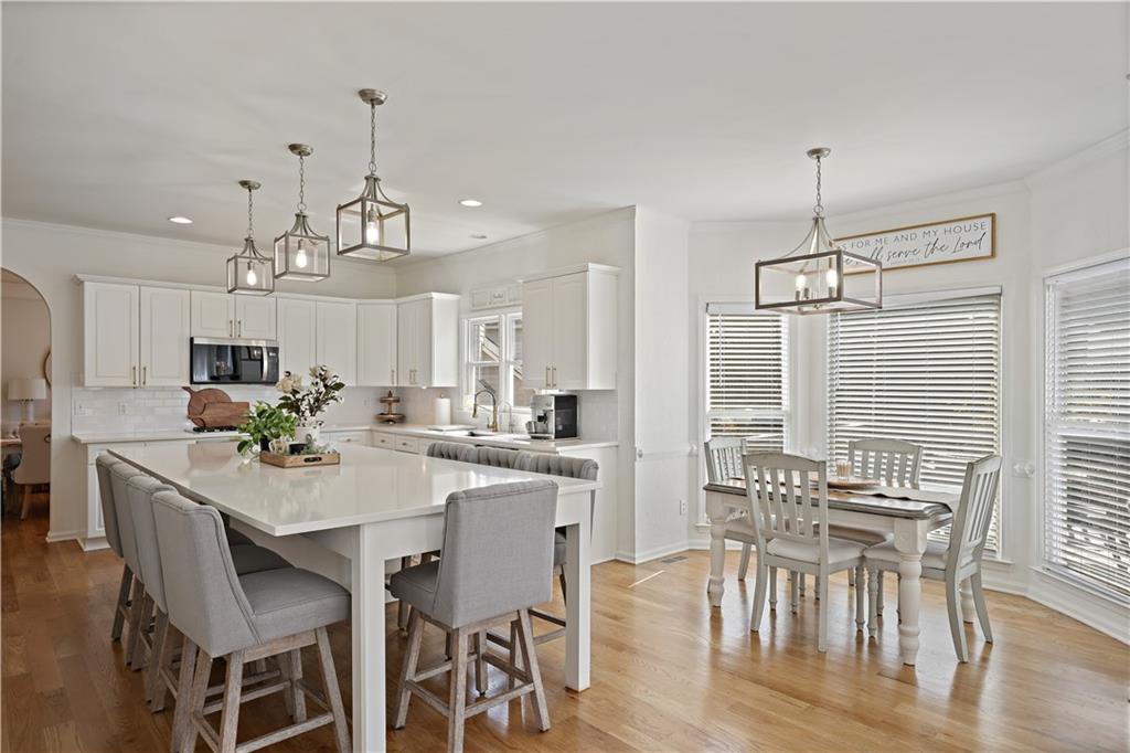 3038 Fairhaven Ridge Northwest Kennesaw, GA 30144 - Photo 3 of 55 a view of a dining room with furniture window and wooden floor