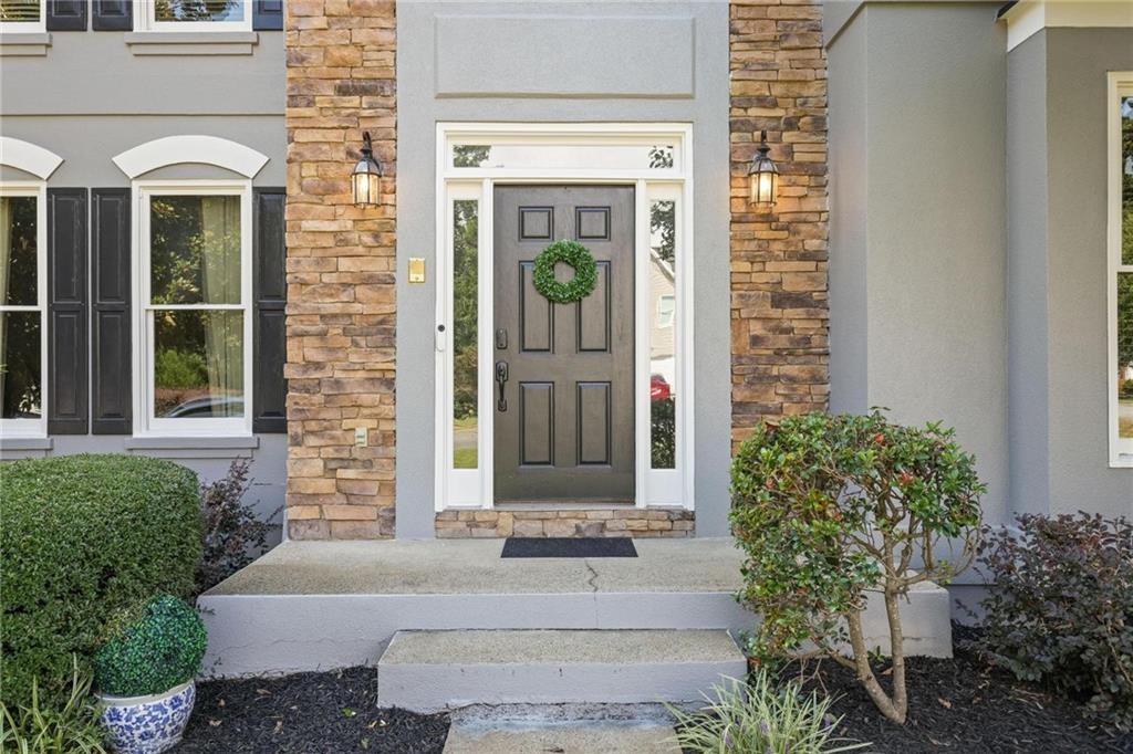 3038 Fairhaven Ridge Northwest Kennesaw, GA 30144 - Photo 39 of 55 a front view of a house with a garden