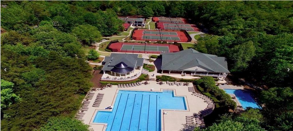 3038 Fairhaven Ridge Northwest Kennesaw, GA 30144 - Photo 48 of 55 an aerial view of a house with outdoor space and trees all around