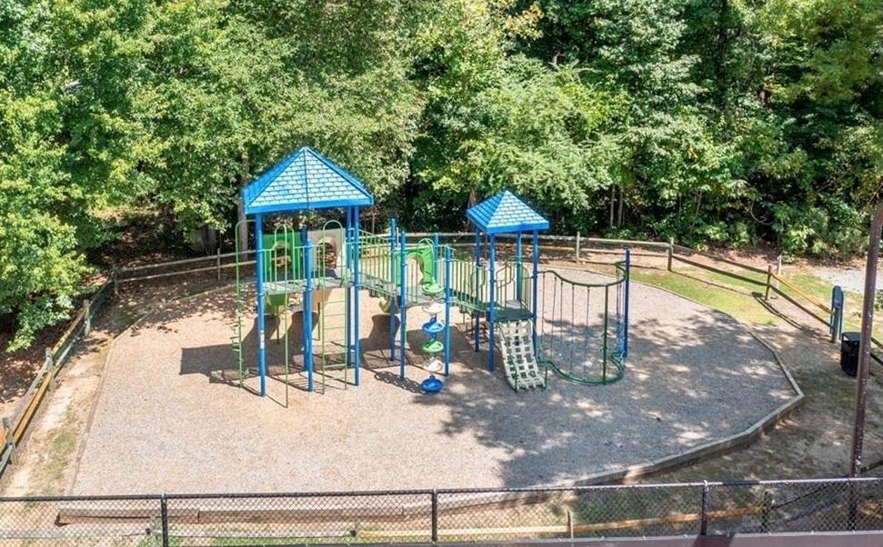 3038 Fairhaven Ridge Northwest Kennesaw, GA 30144 - Photo 52 of 55 a view of a swimming pool with a patio and a yard