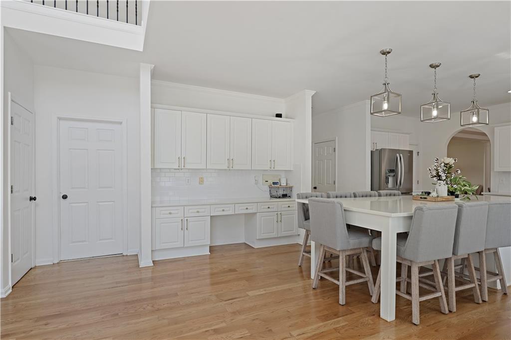 3038 Fairhaven Ridge Northwest Kennesaw, GA 30144 - Photo 6 of 55 a view of a dining room with furniture and wooden floor