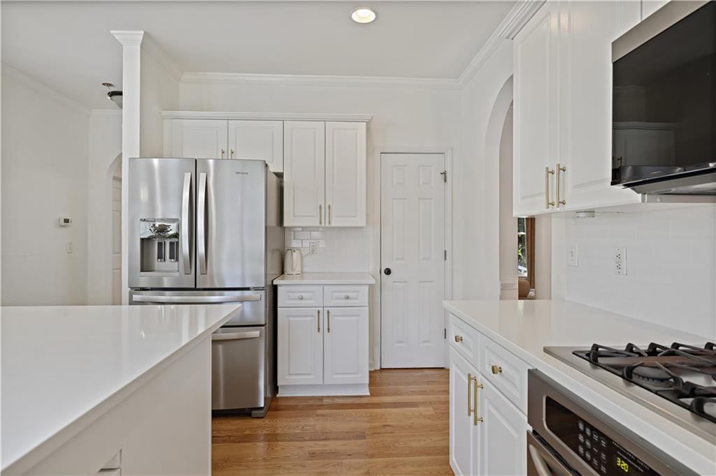 3038 Fairhaven Ridge Northwest Kennesaw, GA 30144 - Photo 10 of 55 a kitchen with stainless steel appliances a refrigerator stove and microwave