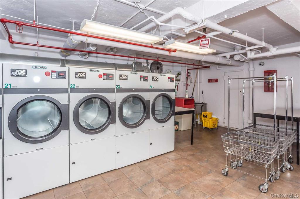 87-10 34th Avenue, Unit 4 Queens, NY 11372 - Photo 2 of 6 a utility room with dryer and washer