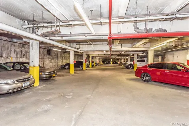 a view of parking area with parked cars