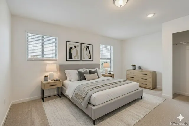 a bedroom with a bed and a couch