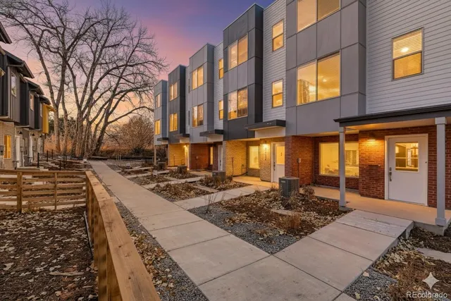 a view of a brick building with many windows