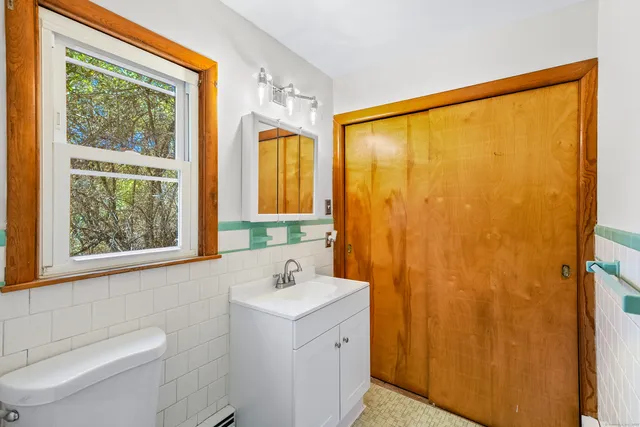 a bathroom with a sink and a large window