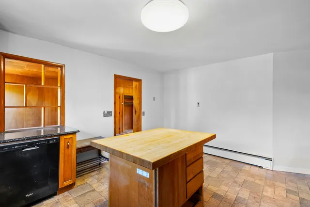 a kitchen that has a microwave and a stove in it