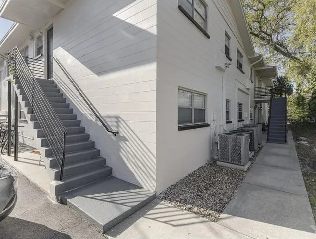 a view of a hallway with entryway and hall