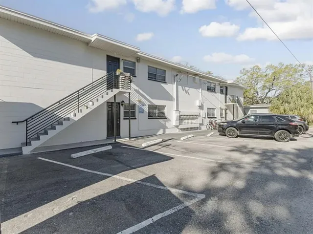 a view of a car park in front of house