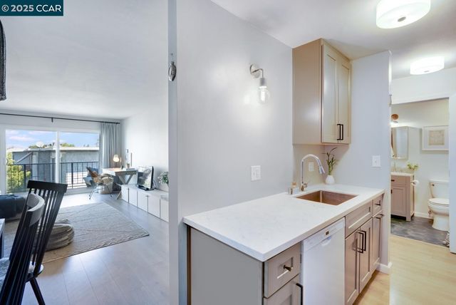 a view of a kitchen counter space and breakfast area