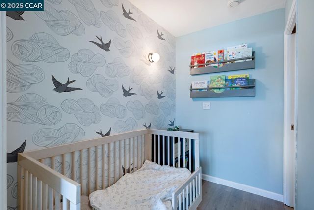 a bedroom with furniture and a book shelf