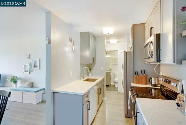 a bathroom with a sink a tub and a mirror