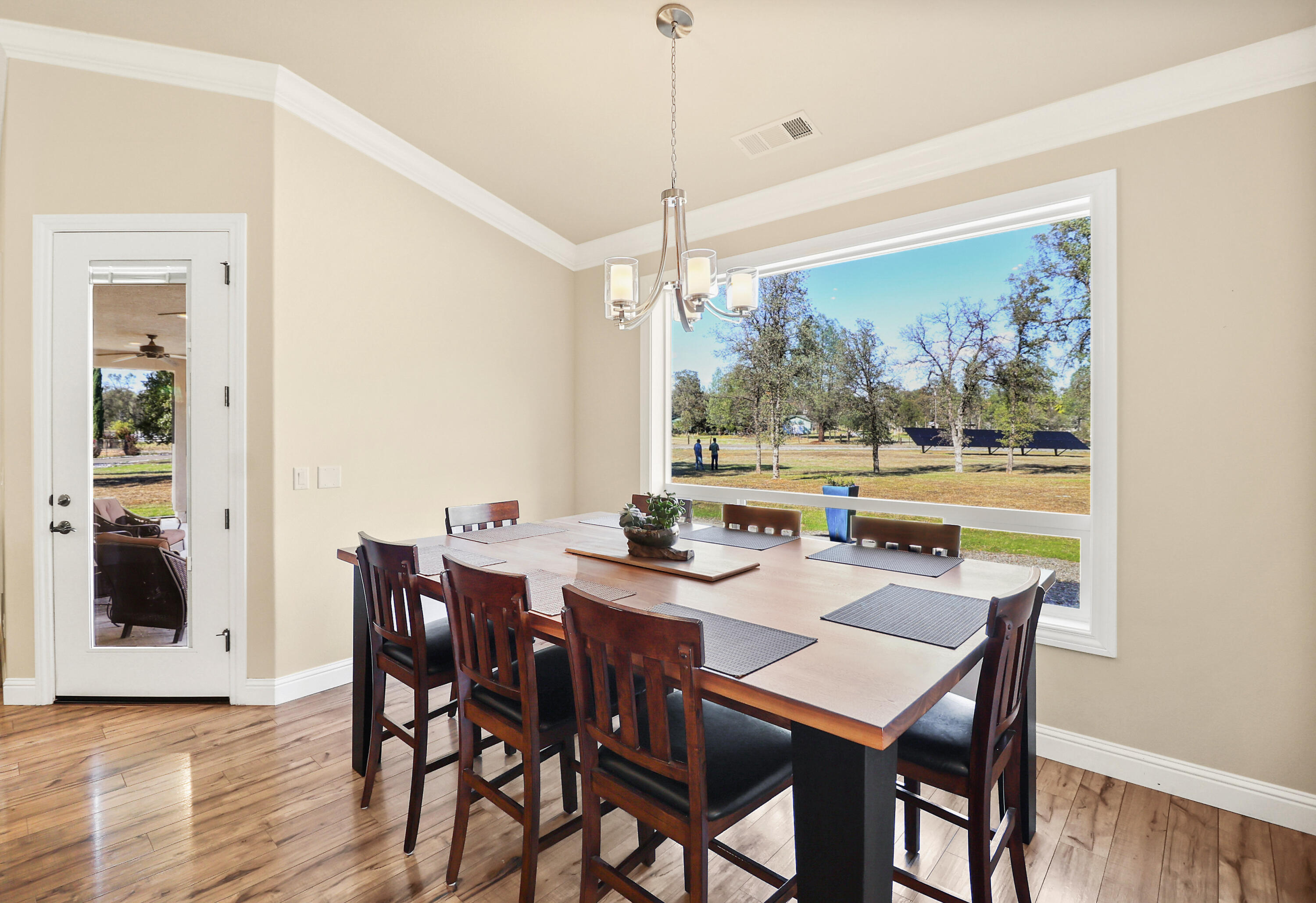 21089 Falling Leaf Road Redding, CA 96003 - Photo 12 of 43 a view of a dining room with furniture window and wooden floor