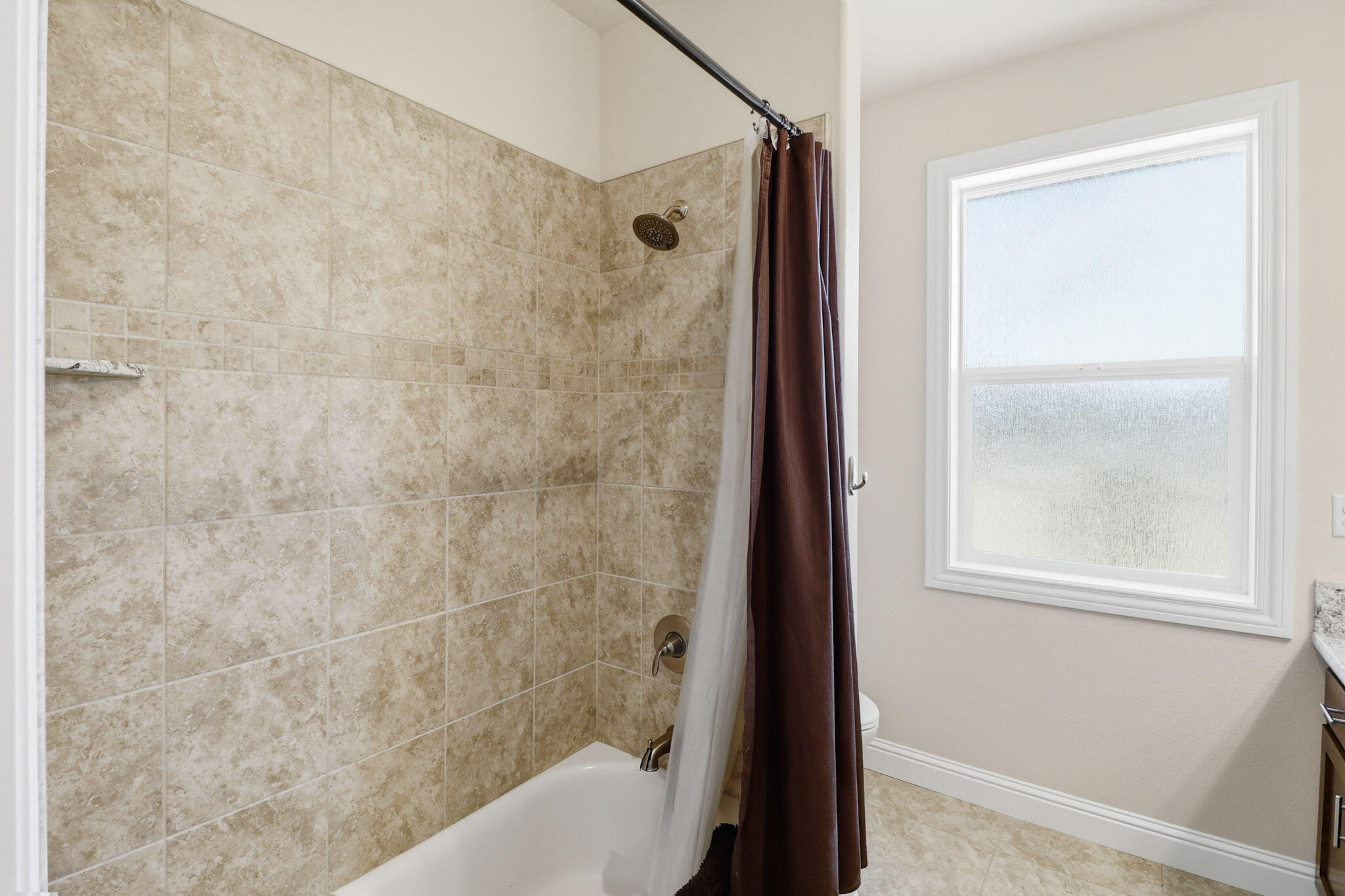 21089 Falling Leaf Road Redding, CA 96003 - Photo 15 of 43 a bathroom with a bathtub and a shower