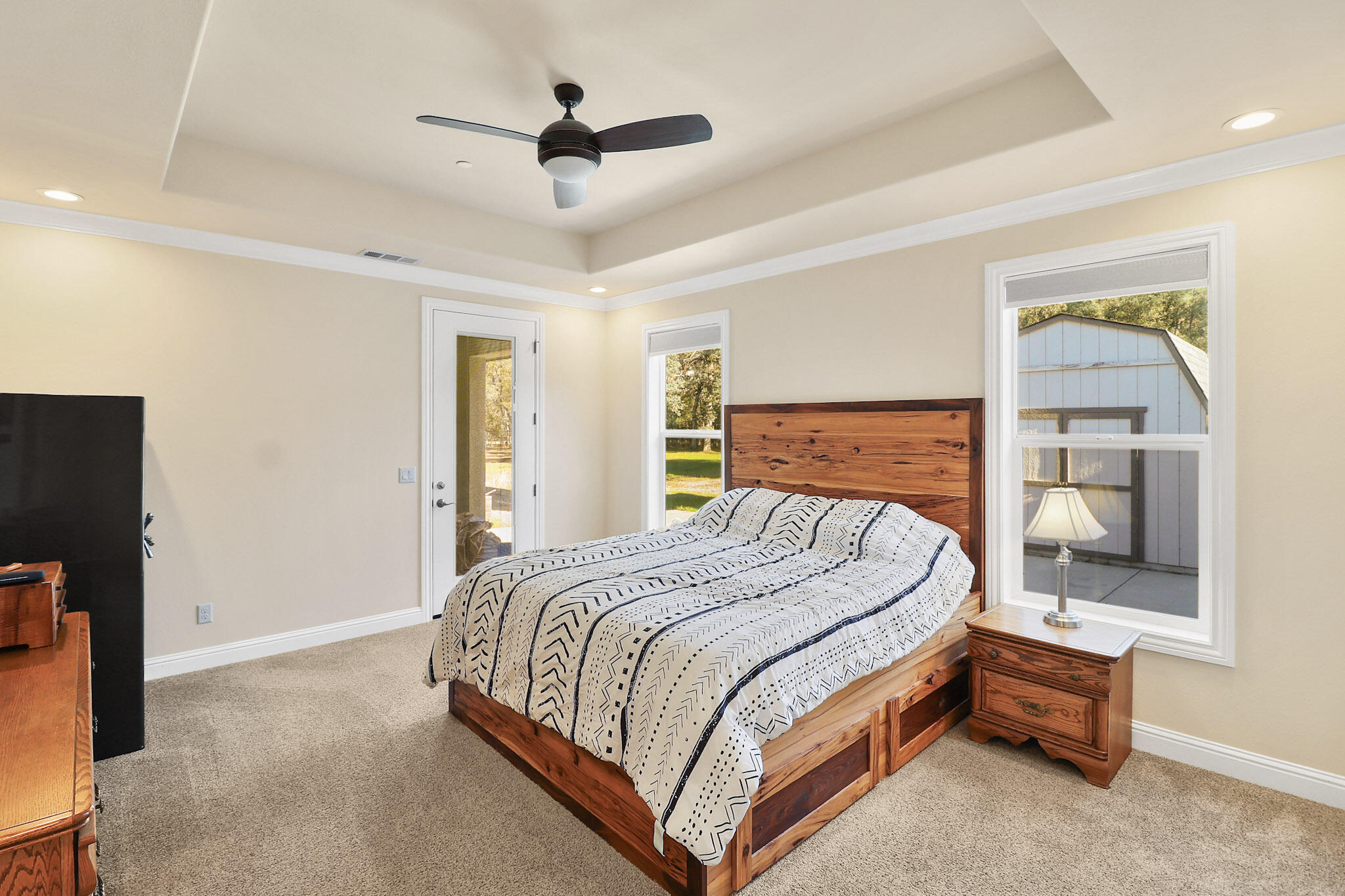 21089 Falling Leaf Road Redding, CA 96003 - Photo 17 of 43 a bedroom with a bed and a walk in closet