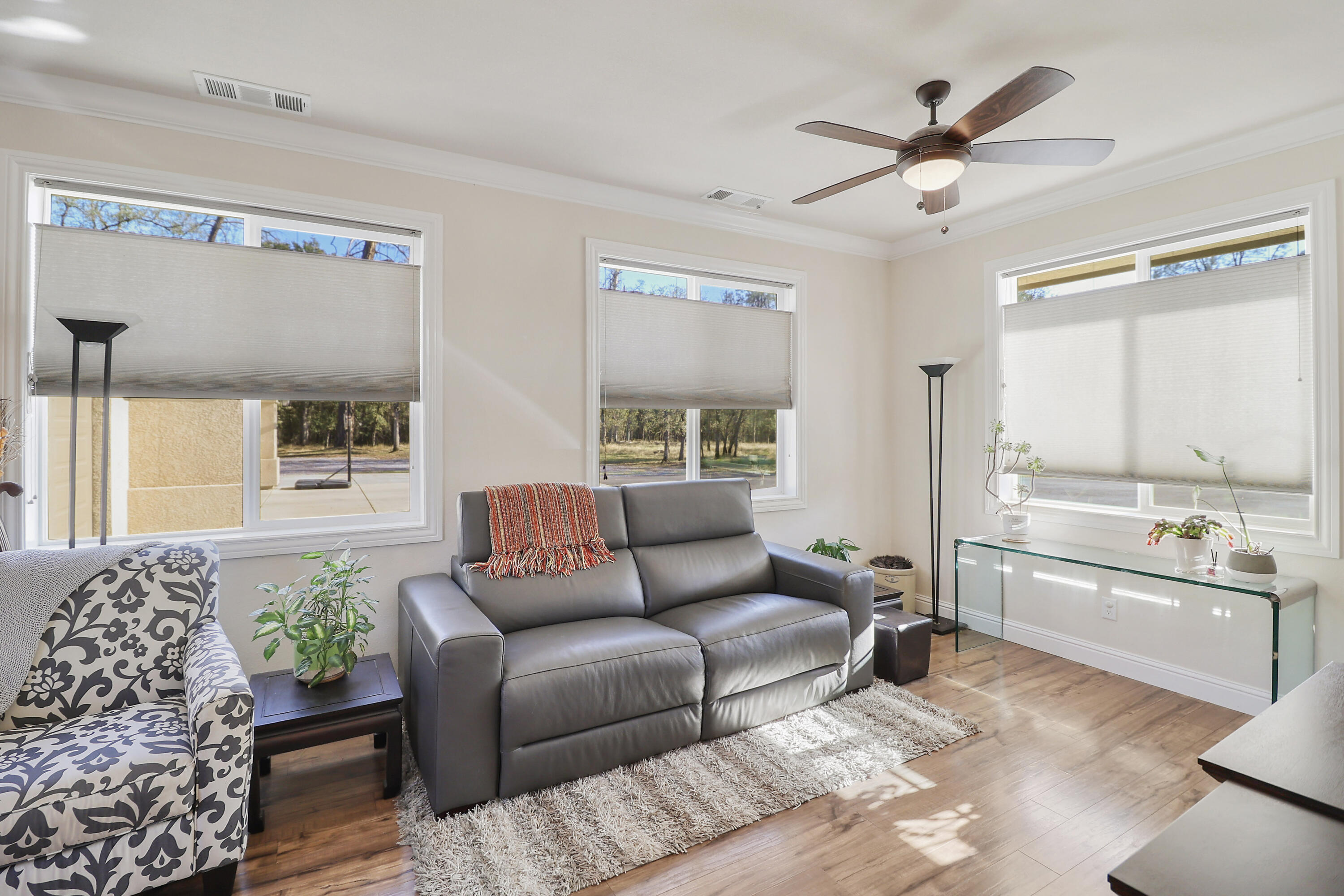 21089 Falling Leaf Road Redding, CA 96003 - Photo 26 of 43 a living room with furniture and a large window
