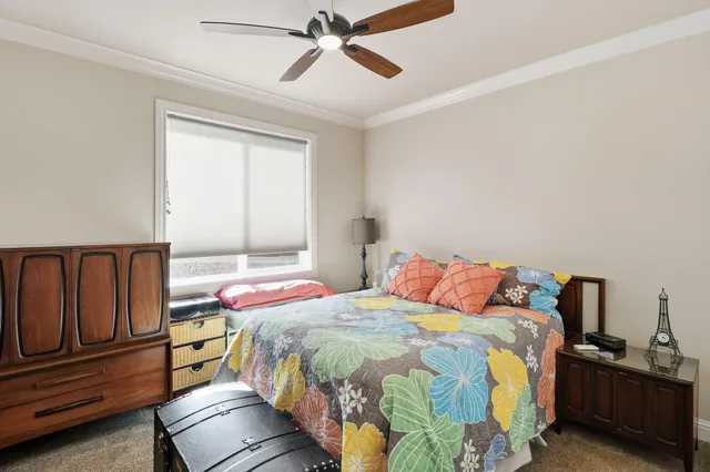 a bedroom with bed and window