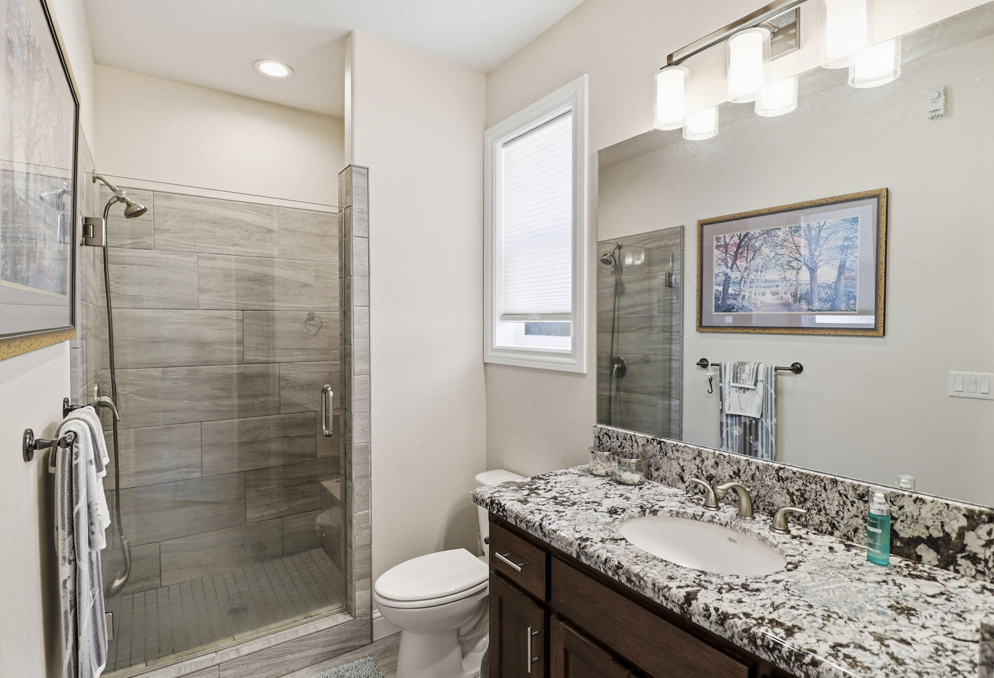 21089 Falling Leaf Road Redding, CA 96003 - Photo 29 of 43 a bathroom with a granite countertop sink toilet and shower