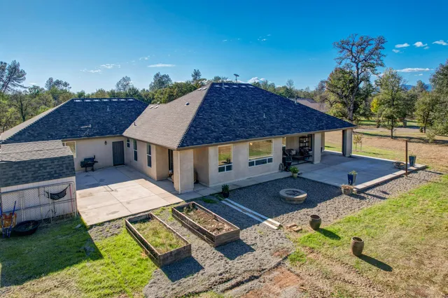aerial view of a house with garden