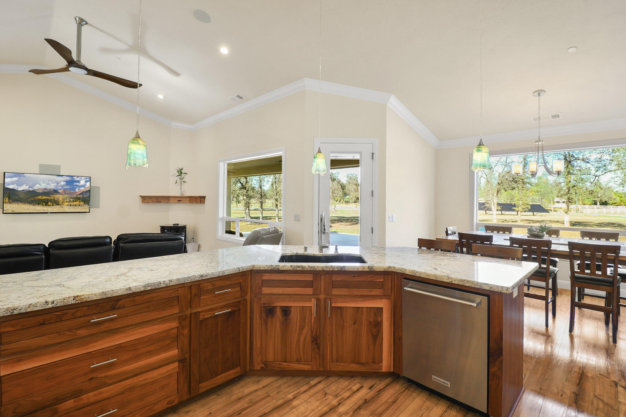 21089 Falling Leaf Road Redding, CA 96003 - Photo 9 of 43 a kitchen with granite countertop a sink and cabinets