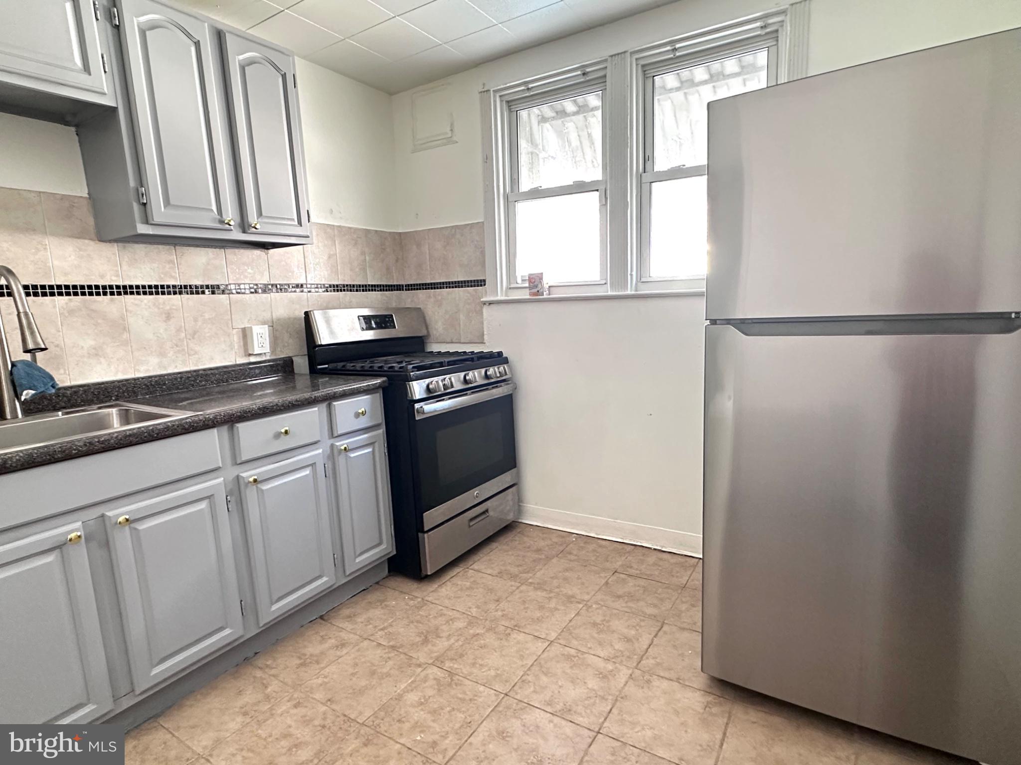 3948 Howland Street Philadelphia, PA 19124 - Photo 5 of 21 Modern kitchen with sleek appliances.