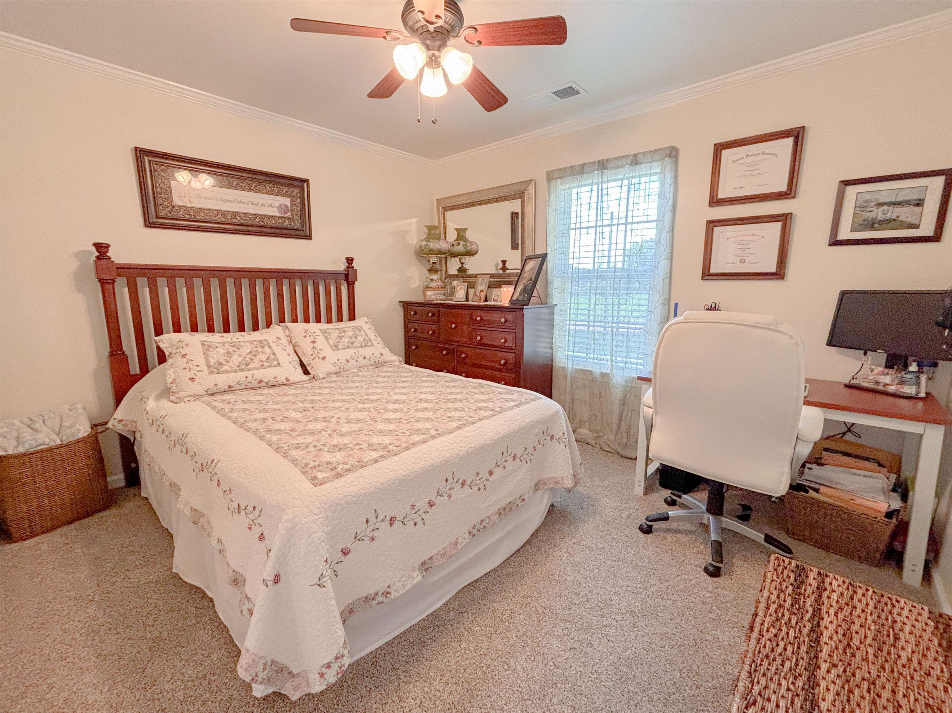 2933 Holly Grove Road Covington, TN 38019 - Photo 17 of 22 Carpeted bedroom with ornamental molding and ceiling fan