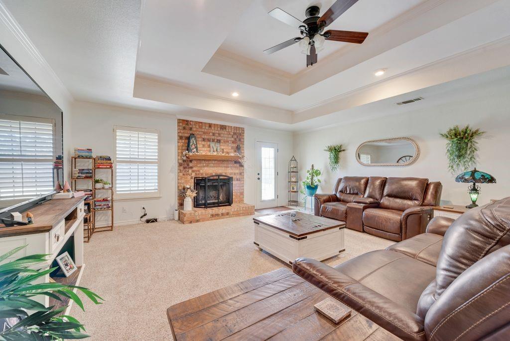 579 South Hitt Street Boyd, TX 76023 - Photo 11 of 34 Large Living Room with Tray Ceiling and Woof Burning Fire Place