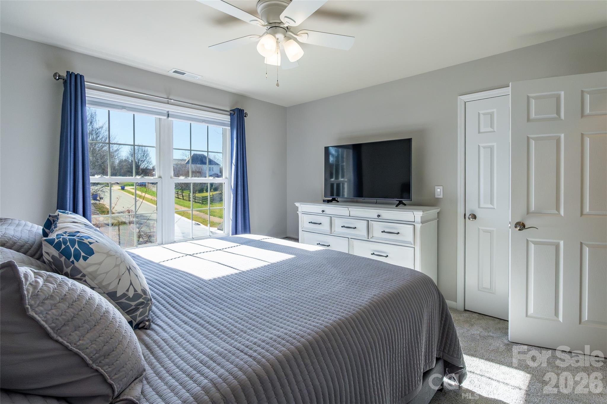16800 Hampton Trace Road Huntersville, NC 28078 - Photo 31 of 48 a bedroom with a bed and a flat screen tv