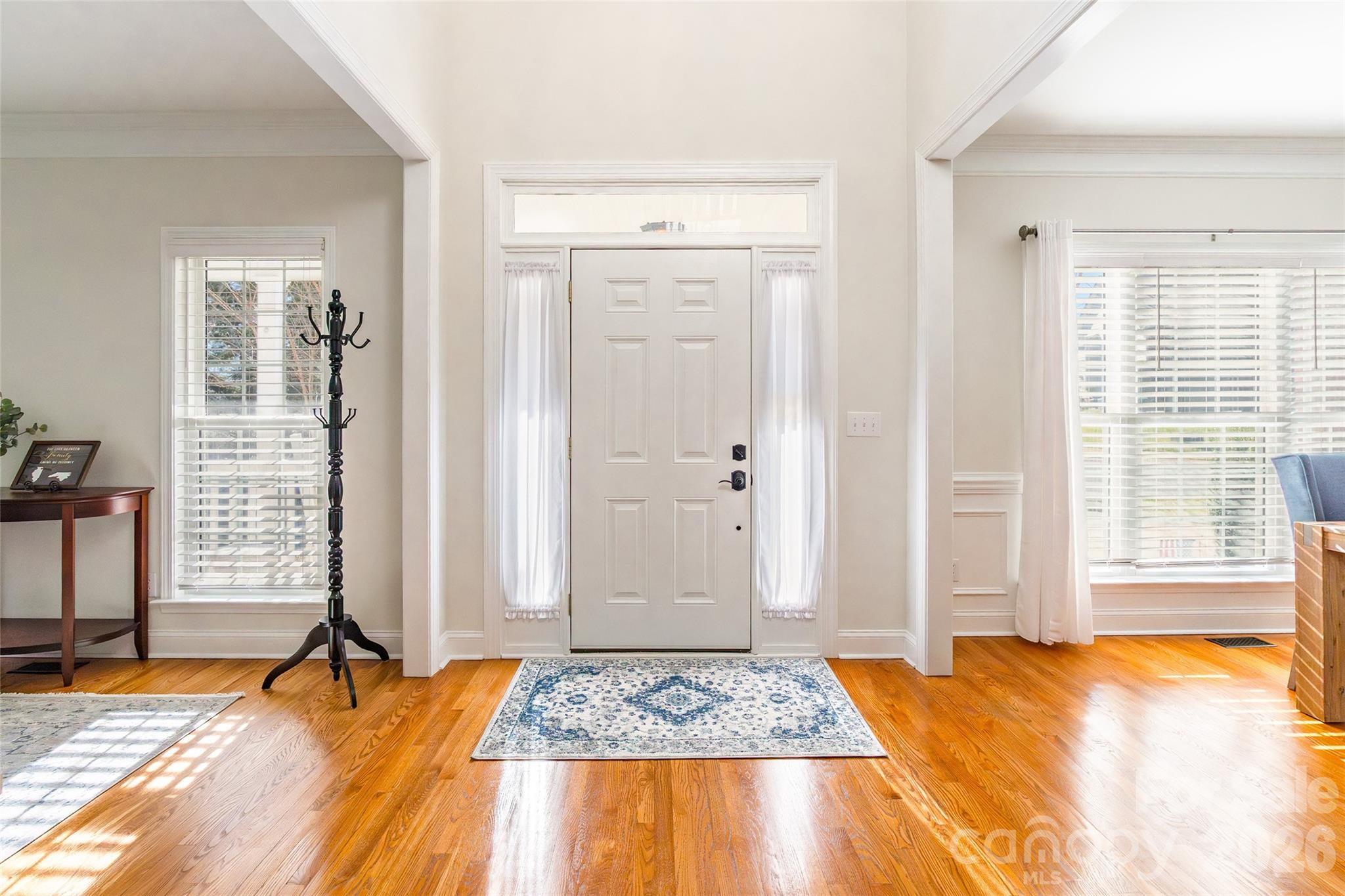 16800 Hampton Trace Road Huntersville, NC 28078 - Photo 4 of 48 a view of an empty room with window and a livingroom