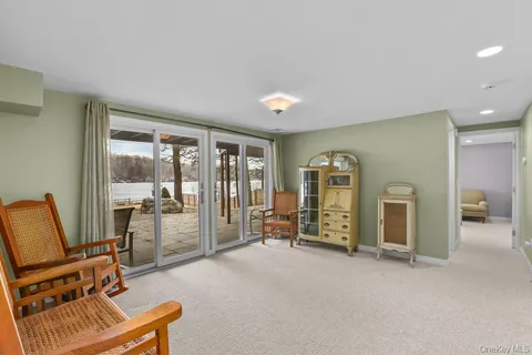 a view of a livingroom with furniture and a flat screen tv