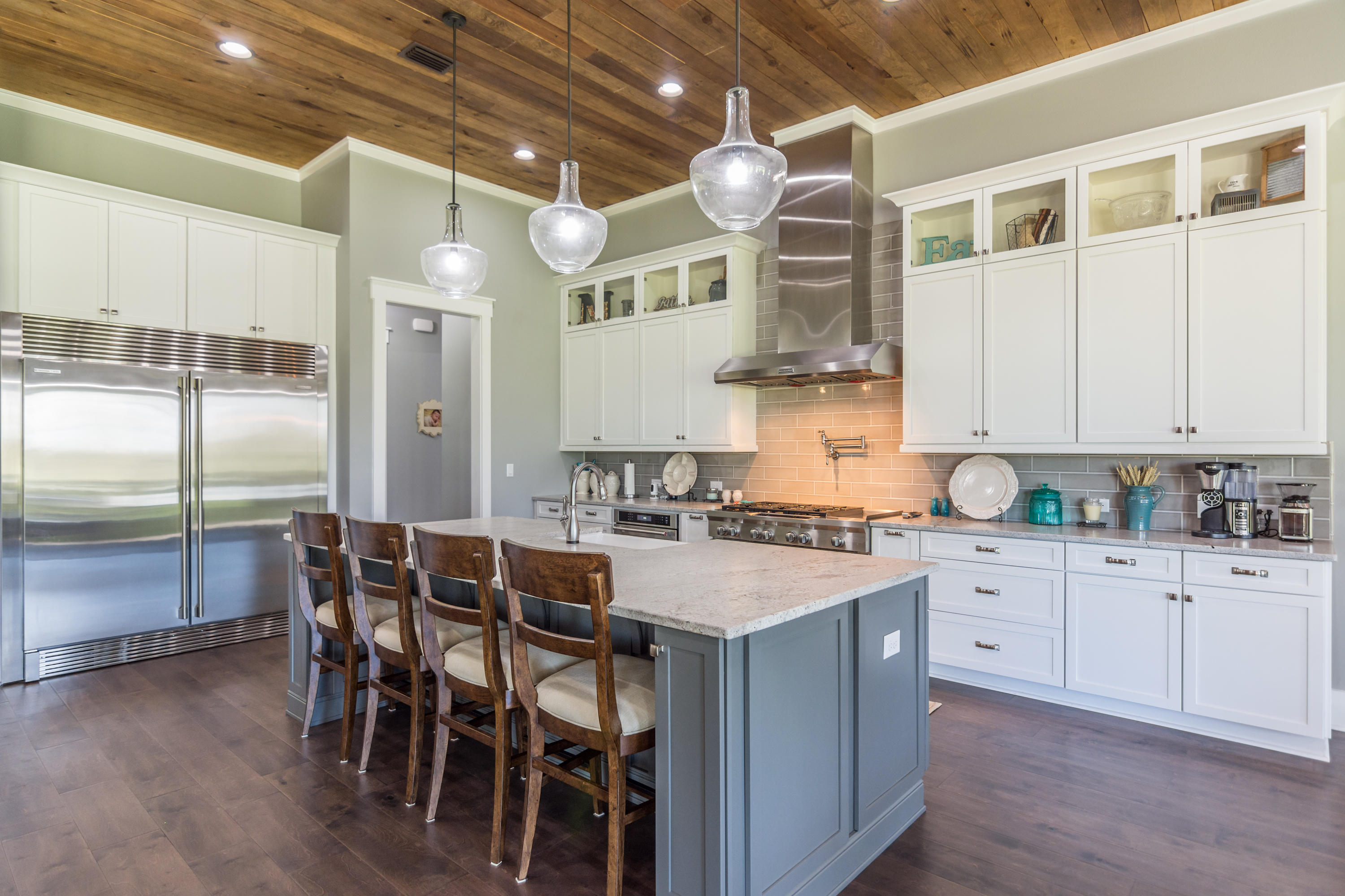 1738 Vinson Ray Road Baker, FL 32531 - Photo 11 of 50 a kitchen with cabinets a sink and chairs