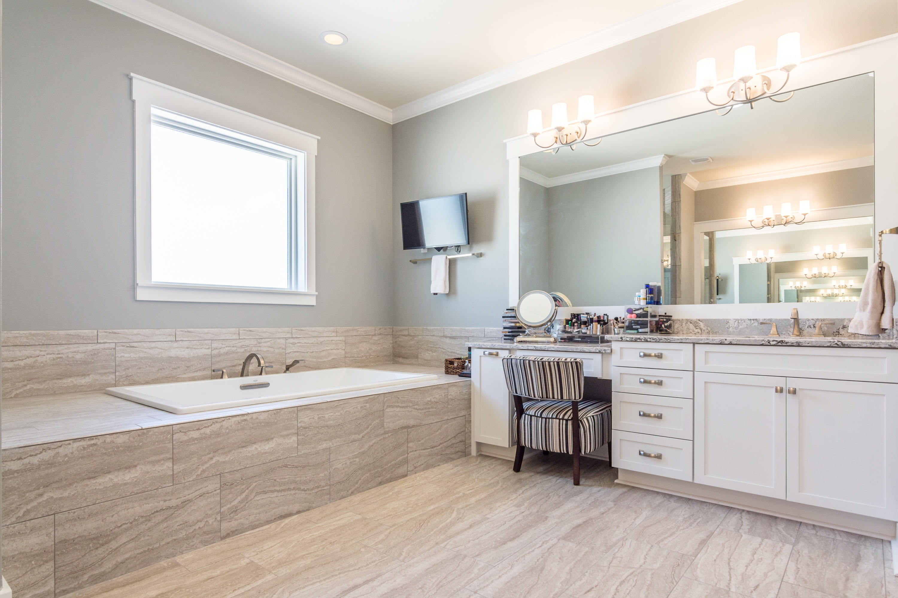 1738 Vinson Ray Road Baker, FL 32531 - Photo 22 of 50 a spacious bathroom with a double vanity sink large mirror and a bathtub