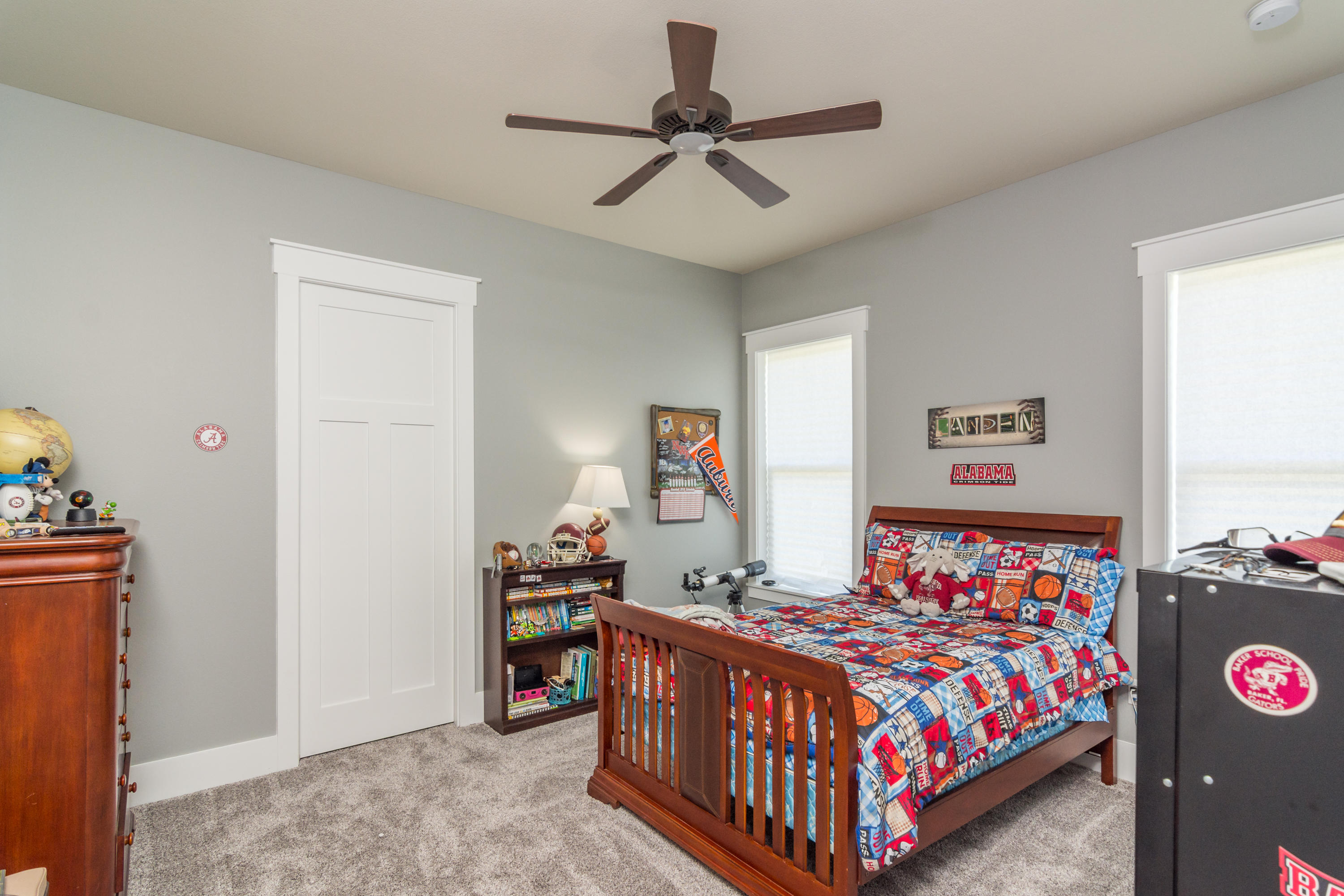 1738 Vinson Ray Road Baker, FL 32531 - Photo 25 of 50 a bedroom with a bed and a table in it