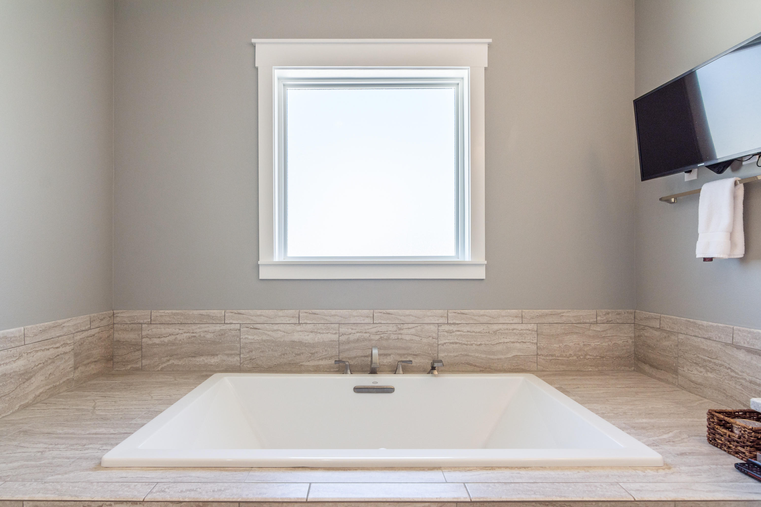 1738 Vinson Ray Road Baker, FL 32531 - Photo 27 of 50 a bathroom with bathtub and window