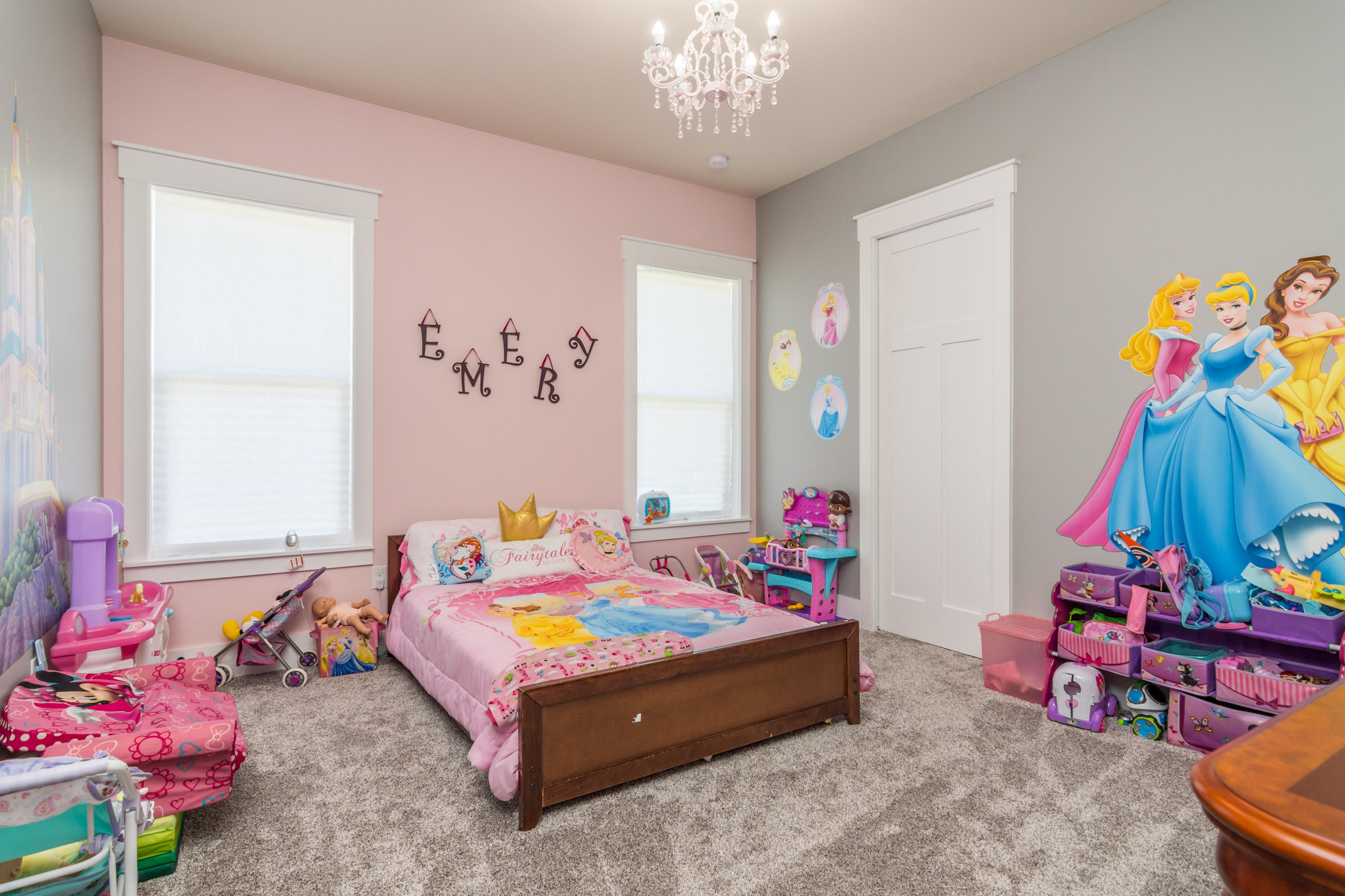 1738 Vinson Ray Road Baker, FL 32531 - Photo 29 of 50 a bedroom with a bed and a chandelier