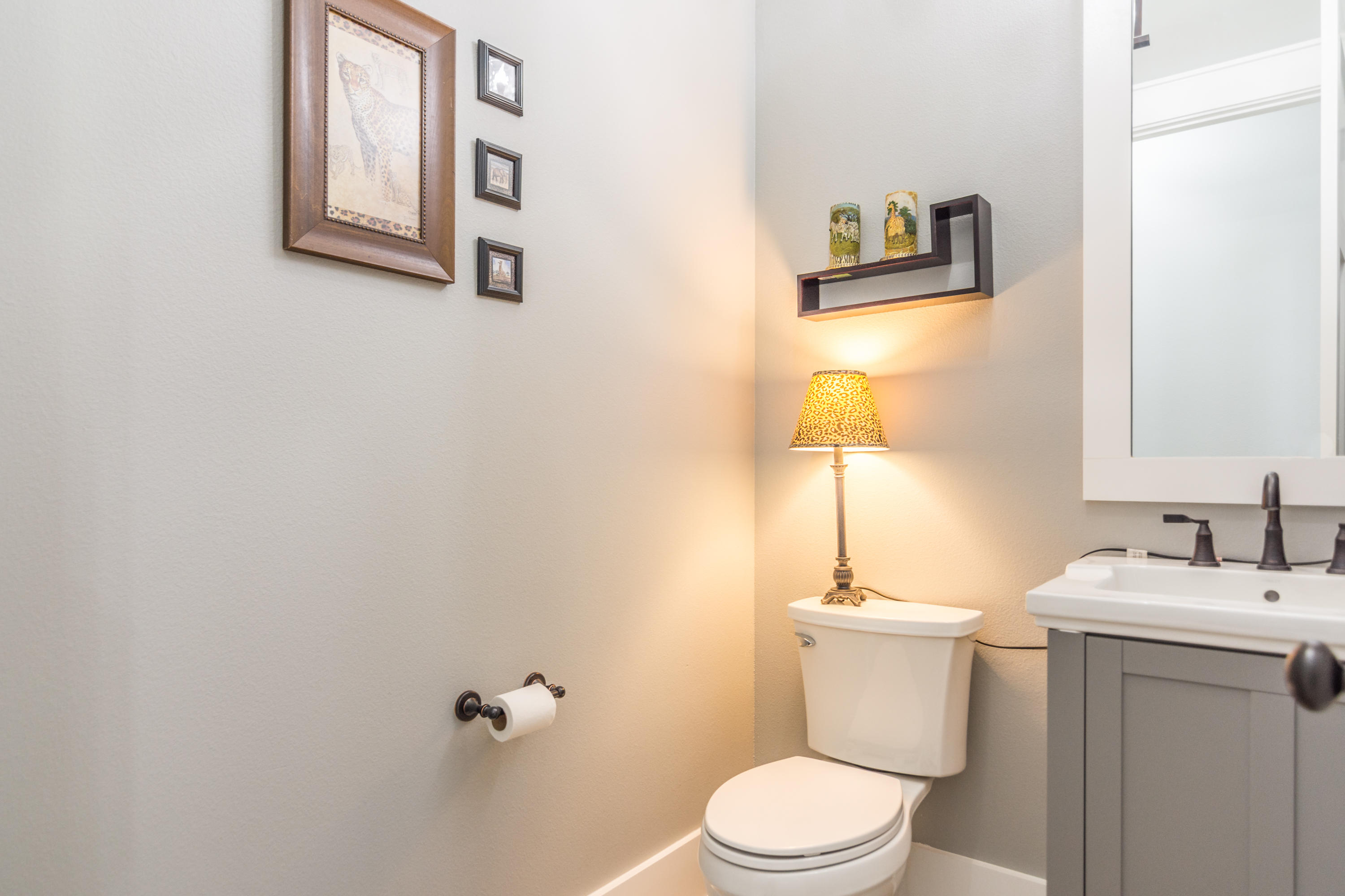 1738 Vinson Ray Road Baker, FL 32531 - Photo 31 of 50 a bathroom with a toilet sink and mirror
