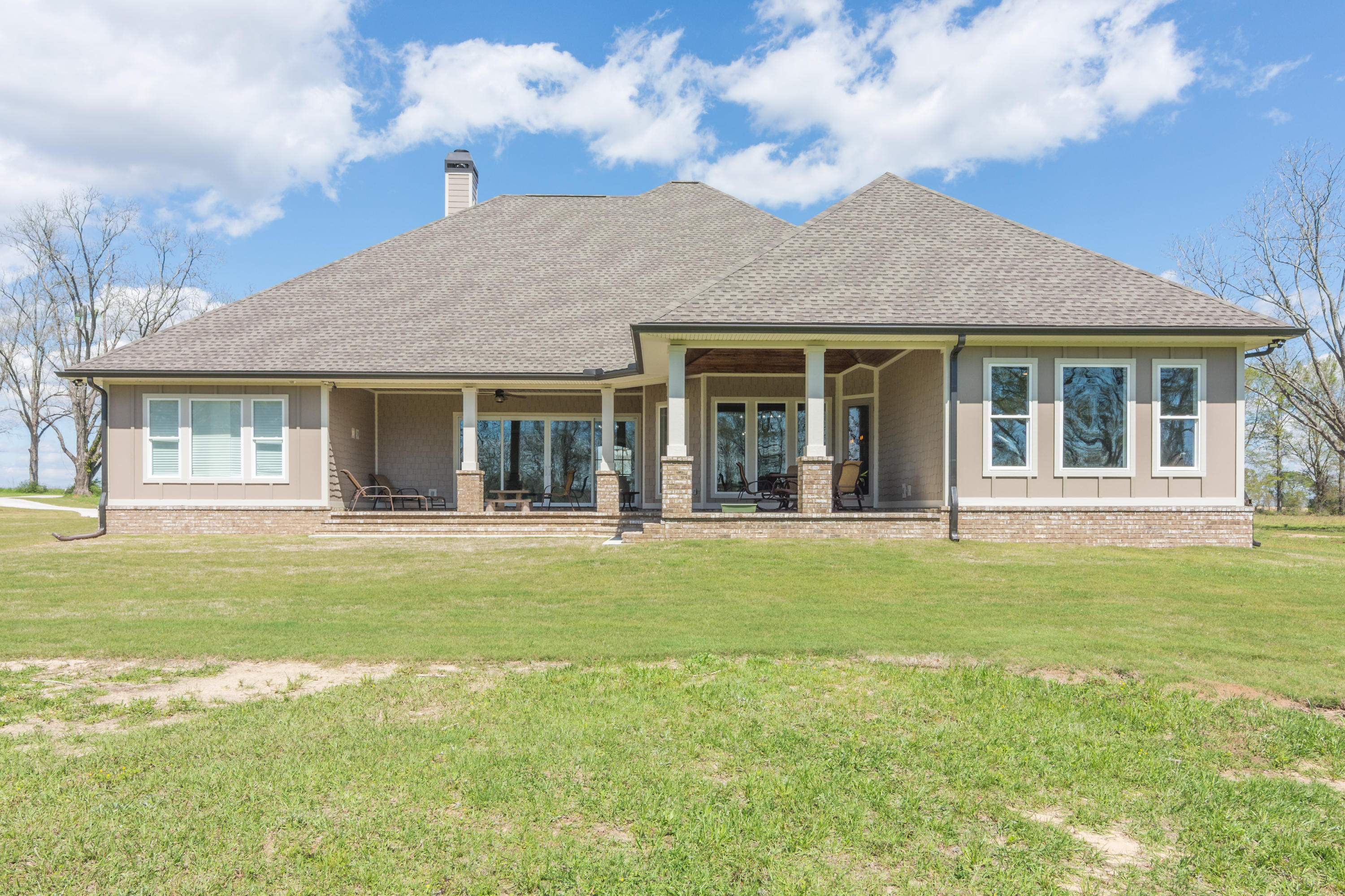 1738 Vinson Ray Road Baker, FL 32531 - Photo 41 of 50 a front view of a house with a garden