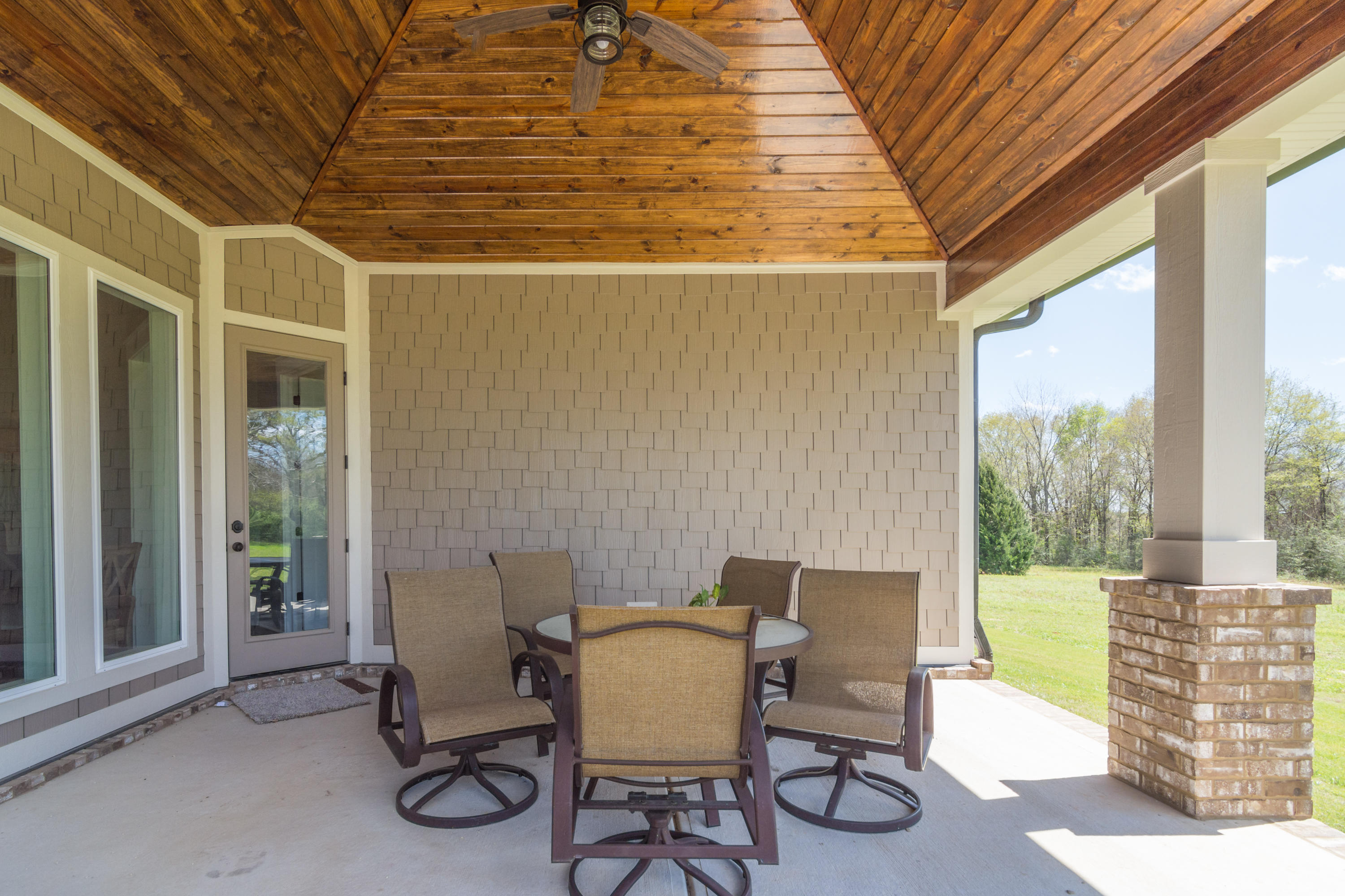 1738 Vinson Ray Road Baker, FL 32531 - Photo 43 of 50 a view of a patio with a table and chairs