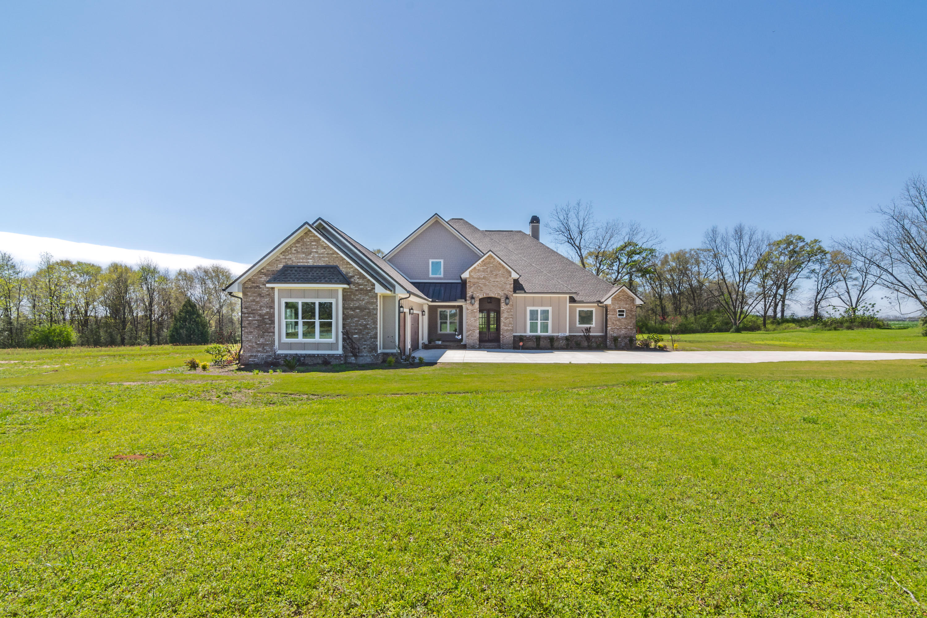 1738 Vinson Ray Road Baker, FL 32531 - Photo 6 of 50 a front view of a house with yard and green space