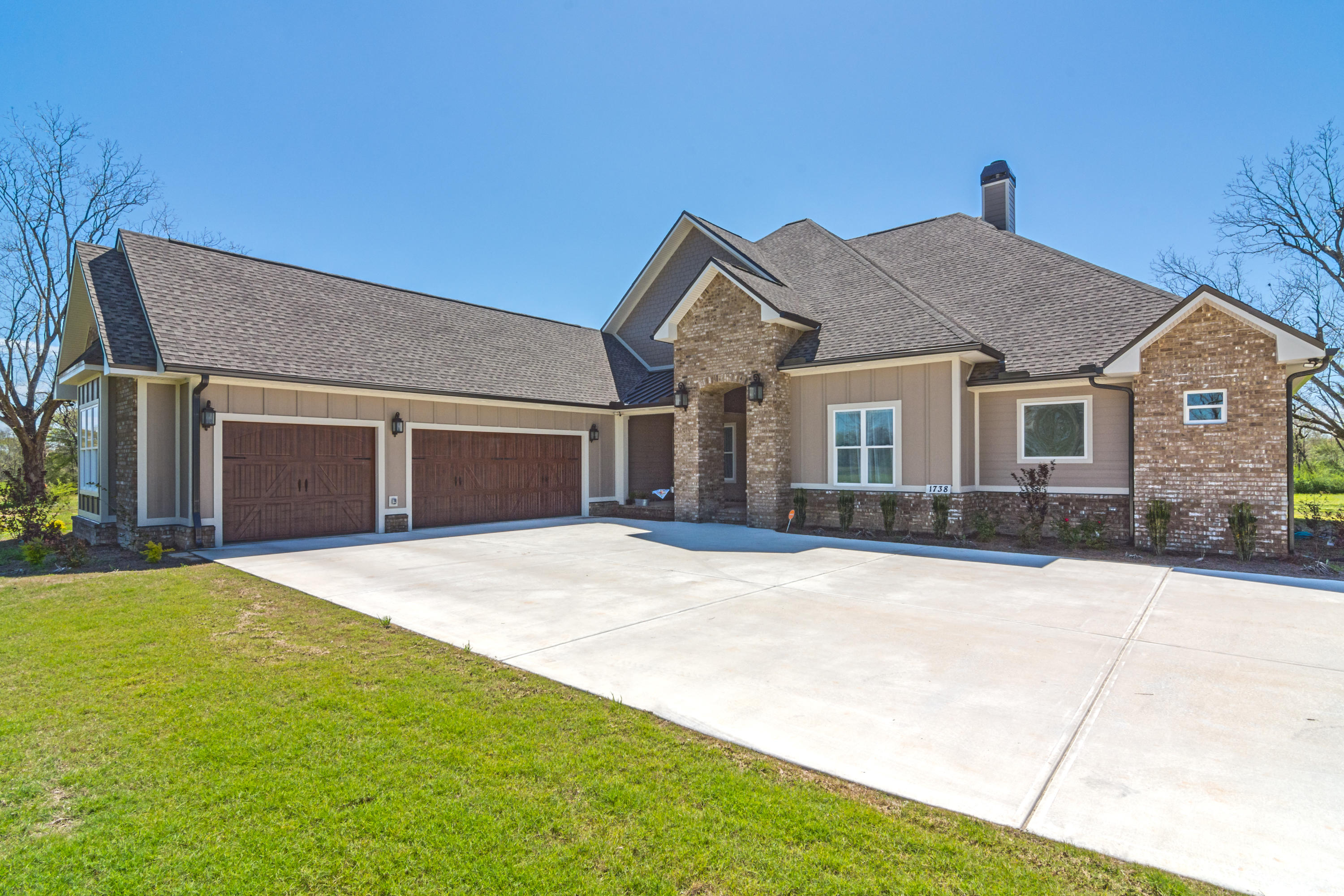 1738 Vinson Ray Road Baker, FL 32531 - Photo 7 of 50 a front view of a house with yard and garage