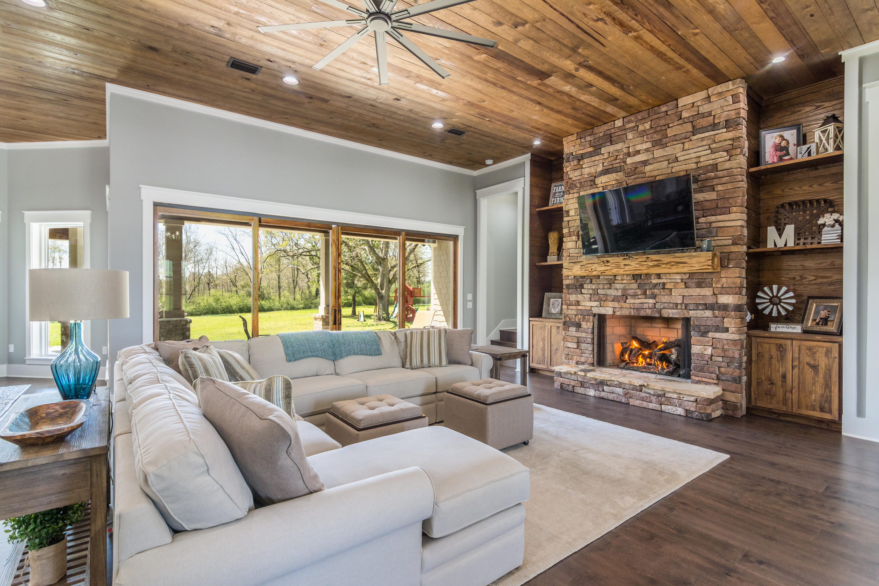 1738 Vinson Ray Road Baker, FL 32531 - Photo 9 of 50 a living room with furniture a flat screen tv and a fireplace