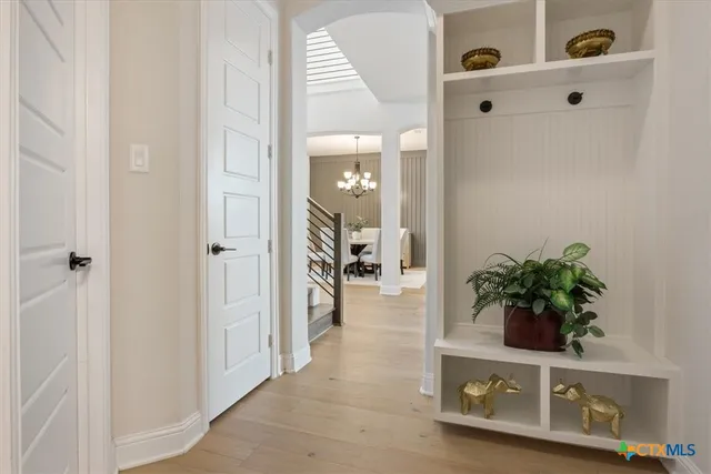 a view of an entryway with wooden floor