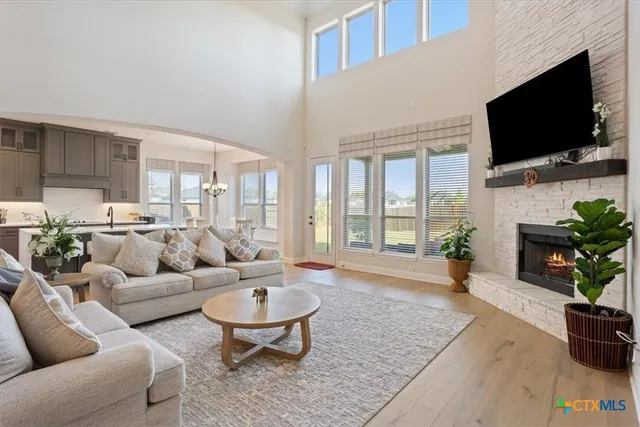 a living room with fireplace furniture and a flat screen tv