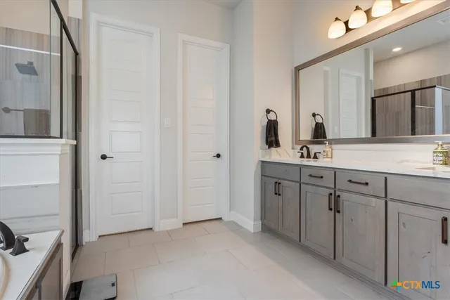 a bathroom with shower and bathtub