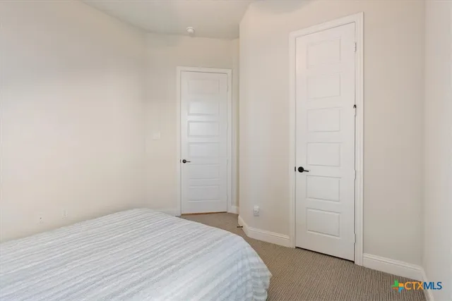 a view of cabinets with washer and dryer