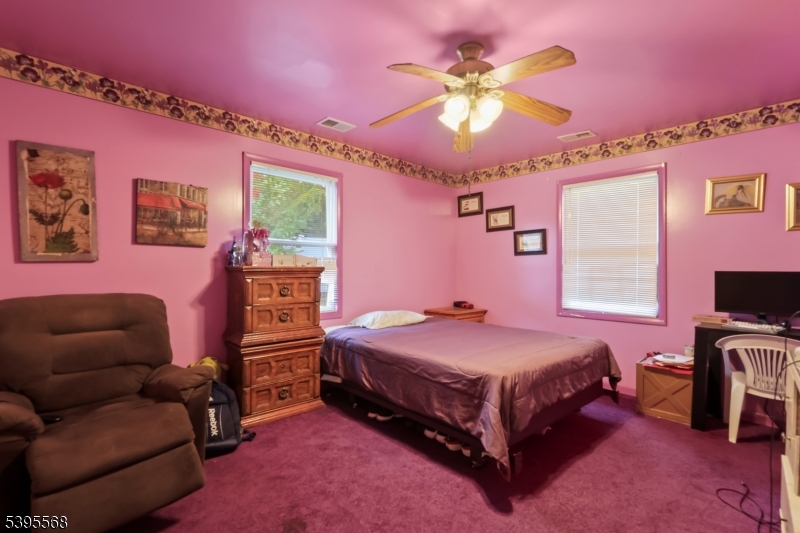 32 Ruby Street Springfield, NJ 07081 - Photo 23 of 31 a bedroom with a bed and a couch
